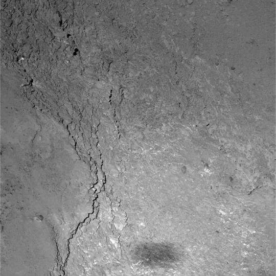 Close-up view of the Imhotep region on comet 67P/Churyumov-Gerasimenko caught by OSIRIS’ Narrow Angle Camera during Rosetta’s flyby on 14 February 2015. Only six kilometers separate Rosetta from the comet’s surface leading to a resolution of 11 centimeters per pixel. At the bottom of the image Rosetta’s shadow can be seen. <br /><br />