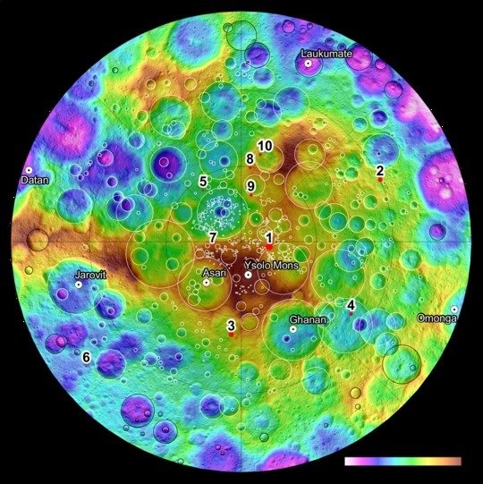 An image of the region near Ceres’ North Pole, the colours show the varying height of the landscape. The numbers refer to ten craters where the Framing Cameras built in Göttingen have discovered water ice.<br /><br />