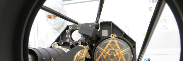 Instrumentation for solar physics research. Working on parts of a solar telescope in the clean room.