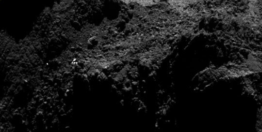 Zooming in towards the current CONSERT ellipse, a number of bright dots are seen in the region. As only one (at most) of these could be the lander, the majority must be associated with surface features on the comet nucleus. <br /><br />