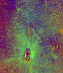 The area inside the two lower craters shows dark and bright regions that also differ spectrally.