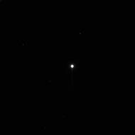 This is the first, unprocessed image obtained by NASA’s Dawn spacecraft of the giant asteroid Vesta in front of a background of stars. It was obtained by Dawn’s framing camera on May 3, 2011, from a distance of about 1.2 million kilometers. Vesta is inside the white glow at the center of the image. The giant asteroid reflects so much sunlight that its size is dramatically exaggerated at this exposure. This and other images help Dawn fine-tune navigation during its approach to Vesta, with arrival expected on July 16, 2011.