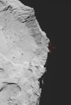 Rosetta’s OSIRIS wide-angle camera captured this view of Comet 67P/Churyumov–Gerasimenko on 12 November 2014 at 17:18 GMT (onboard spacecraft time), with what is thought to be Philae above the rim of the large depression (marked). The image has been used to guide subsequent lander search efforts, and provides the basis for trajectory reconstructions.