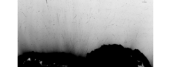 This is a composite image of 20 single exposures showing the motion of individual chunks as tracks of black dots.