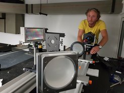 MPS scientist Hans-Peter Doerr mounting the new infrared camera at the GREGOR telescope.