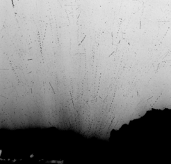 Metre-sized chunks of debris above the surface of comet 67P. This is a composite of 20 images obtained with the Rosetta/OSIRIS camera within a time frame of 6 minutes on 6 January 2016 from a distance of 86 km. The dotted tracks represent the motion of individual pieces of debris over the timeframe of the observations. It is possible that these chunks still contain ice and are outgassing (Agarwal et al., 2016).