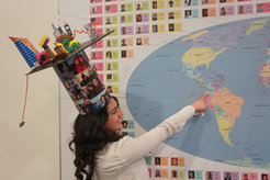After successfully defending her PhD thesis, Eliana Amazo Gómez points to Colombia on the “IMPRS world map”, which shows the home countries of all former graduates of the “Solar System School”. She is the first Colombian graduate of the “Solar System School”.