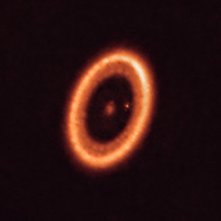 Snapshot of a planetary system in the making. This image of the PDS 70 system, which is almost 400 light-years away from the Sun, was taken with the help of the ALMA radio telescope observatory. At least one planet orbits the star at the center of the system, as well as a remaining disc of gas and dust further out.